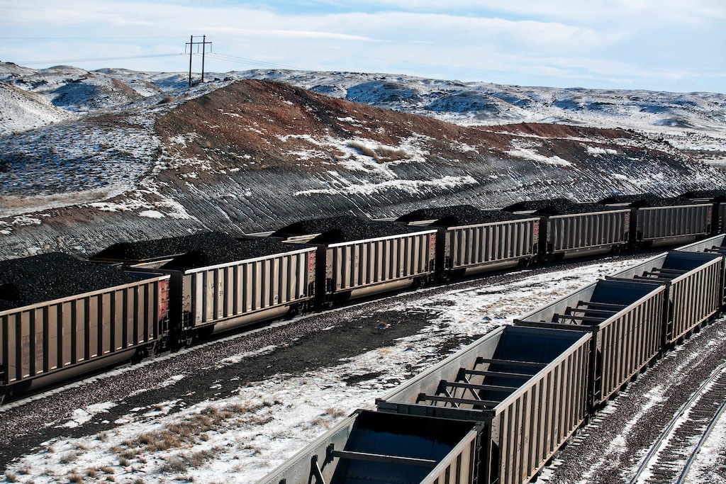 (Ryan Dorgan | The Casper Star-Tribune via AP file)Rail cars are filled with coal and sprayed with a topper agent to suppress dust at Cloud Peak Energy's Antelope Mine north of Douglas, Wyo., in January 2014. A judge on Monday approved the sale of three mines in Wyoming and Montana owned by a bankrupt coal company, helping to keep the mines open and allow repayment of debt.