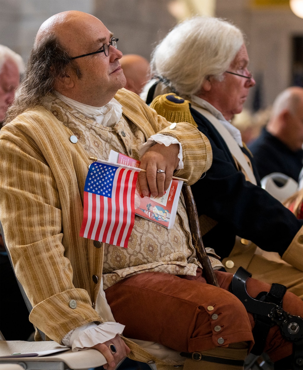 (Rick Egan | The Salt Lake Tribune) Wade Alexander, dressed as Benjamin Franklin, listens to speakers during the Constitution Month kickoff at the Capitol on Thursday, Aug. 31, 2023.
