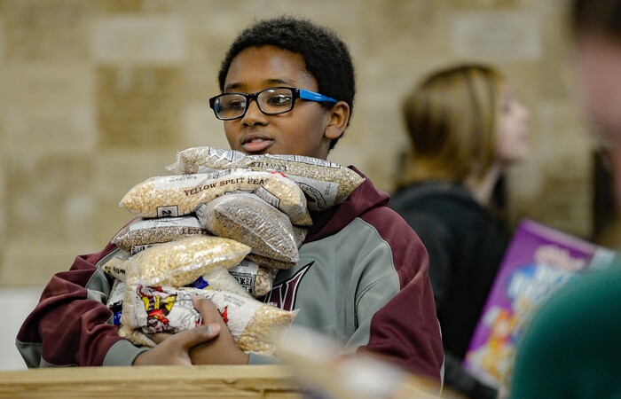 (Francisco Kjolseth  |  The Salt Lake Tribune) Ahmed Babakir, 13, a member of YouthCity Government volunteers unloading donated food at the Utah Food Bank on Monday, Jan. 20, 2020, to celebrate the 2020 Martin Luther King Jr. Day of Service.