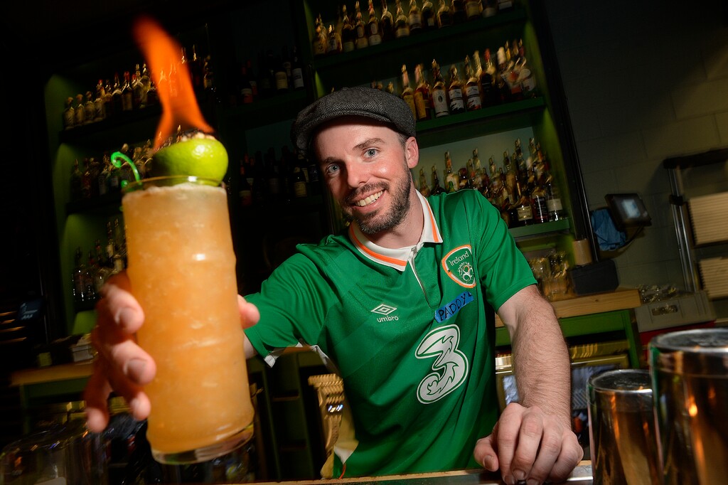 Scott Sommerdorf | The Salt Lake TribuneBartender Pat Harrington serves up a flaming Mai Tai at Water Witch, Friday, March 17, 2017.
