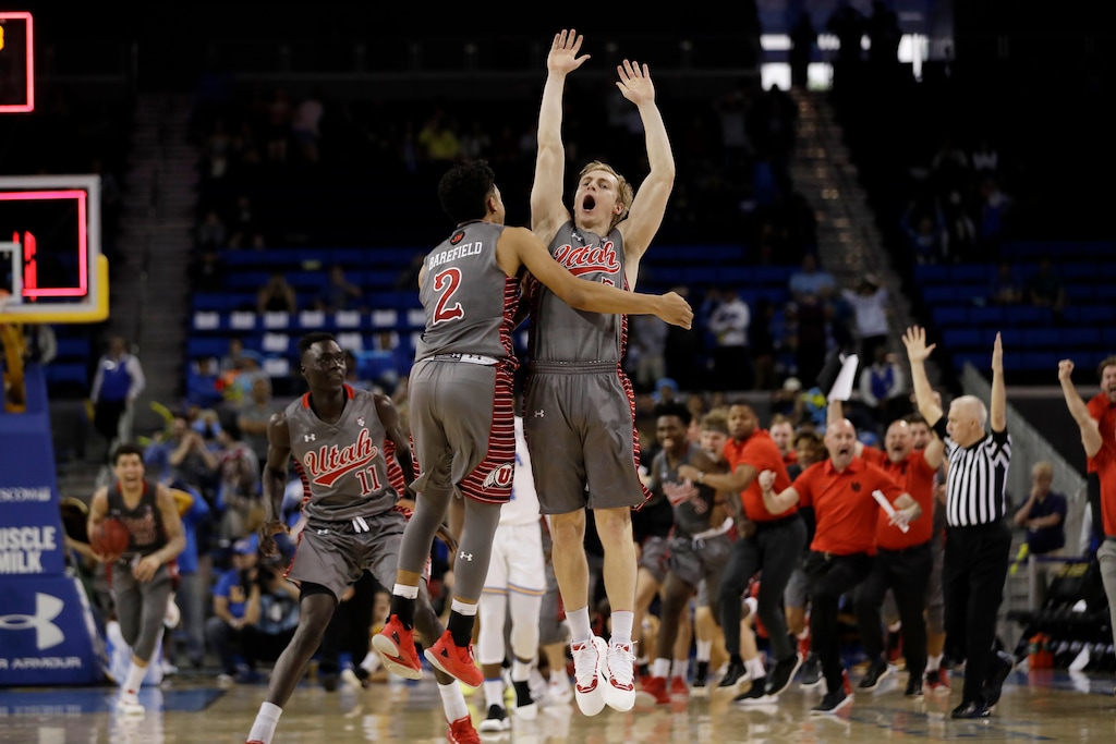 Utah guard Parker Van Dyke, center right, celebrates his winning three-point basket with teammates Sedrick Barefield (2) and Both Gach (11) as time expires during the second half of an NCAA college basketball game against UCLA Saturday, Feb. 9, 2019, in Los Angeles. (AP Photo/Marcio Jose Sanchez)
