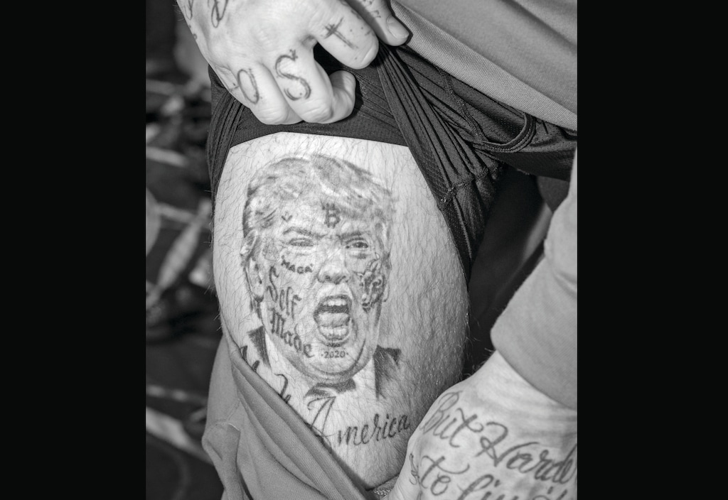 A man shares his tattoo of former President Donald Trump at the Conservative Political Action Conference in National Harbor, Md., March 4, 2023. (Mike Osborne/The New York Times)