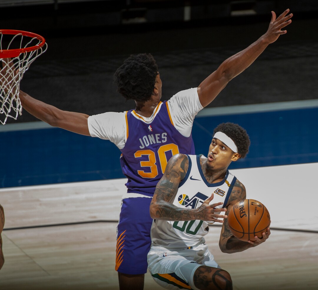 (Rick Egan | The Salt Lake Tribune)  Utah Jazz guard Jordan Clarkson (00) looks for a shot, as Phoenix Suns center Damian Jones (30) defends, in preseason NBA action between Utah Jazz and Phoenix Suns at Vivint SmartHome Area, on Saturday, Dec. 12, 2020.