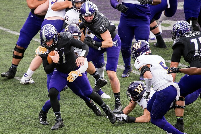 (Chris Detrick  |  The Salt Lake Tribune)  Western Illinois Leathernecks linebacker Riggs Baxter (58) tackles Weber State Wildcats quarterback Stefan Cantwell (11) during the game at Stewart Stadium Saturday, November 25, 2017.  