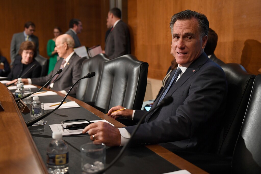 (Susan Walsh | AP file photo)  Sen. Mitt Romney, R-Utah, talks with a colleague during a break in an executive session of the Senate Health, Education, Labor and Pensions Committee on Capitol Hill in Washington, Tuesday, Sept. 24, 2019.