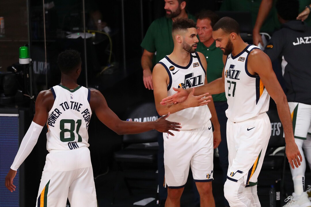 (Kim Klement | Pool via AP) Utah Jazz guard Miye Oni (81), forward Georges Niang (31), and center Rudy Gobert (27) celebrate after Game 2 of an NBA basketball first-round playoff series, Wednesday, Aug. 19, 2020, in Lake Buena Vista, Fla.