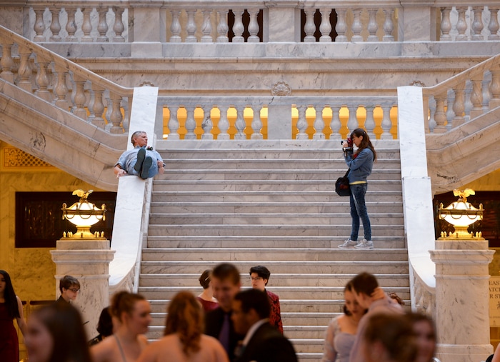 (Leah Hogsten  |  The Salt Lake Tribune) Deanna Baird takes pictures of her husband Tom Baird while the two documented the dance for their daughter Amanda Baird, a student of Utah Virtual Academy. Three virtual charter schools, Utah Virtual Academy, Utah Connections Academy and Mountain Heights Academy, co-hosted prom for their students, Friday, April 27, 2018. 
