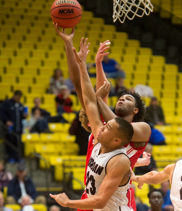 (Rick Egan  |  The Salt Lake Tribune)  East Leopards Mikey Frazier (45) shoots as Jordan Beatdiggers Dyson Frank (23) defends, in 5A basketball playoff action between the East Leopards and the Jordan Beatdiggers at the UCCU Center in Orem, Monday, Feb. 26, 2018.