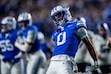 (Trent Nelson | The Salt Lake Tribune) BYU Cougars defensive back Evan Johnson (0) celebrates after sacking Texas Christian University Horned Frogs quarterback Josh Hoover (10) as BYU hosts TCU, NCAA football in Provo on Saturday, Nov. 15, 2025.
