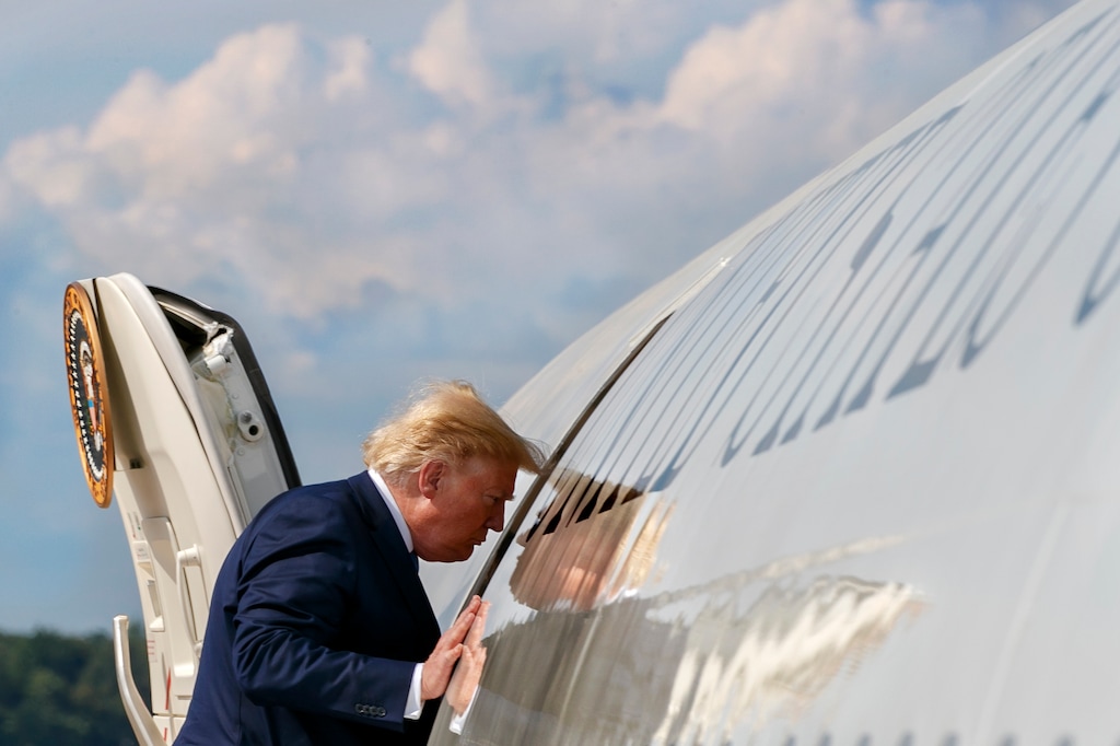 (Jacquelyn Martin | AP) President Donald Trump boards Air Force One, Friday, Aug. 2, 2019, at Andrews Air Force Base, Md., en route to New Jersey.