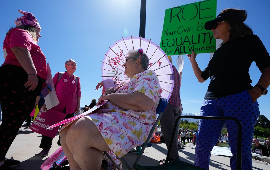 (Francisco Kjolseth | The Salt Lake Tribune) Rachel Becker, Marie Fulmer, Mary Phillips and Nan Sturgeom, from left, join about 2,500 protesters at the Utah Capitol for a “Bans Off Our Beehive” rally in support of abortion rights on Saturday, May 14, 2022.