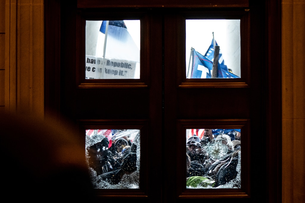 (Erin Schaff | The New York Times) Pro-Trump protesters storm the Capitol in Washington, Wednesday, Jan. 6, 2021, on the same day as a joint session of Congress met to certify the electoral votes from the 2020 presidential election. President Trump’s efforts to overturn the 2020 presidential election came to a dangerous head on Wednesday when a mob of his supporters stormed the Capitol following a rally in which Trump once again falsely claimed widespread voter fraud.