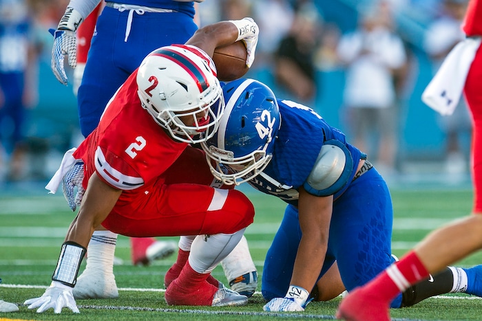 (Chris Detrick  |  The Salt Lake Tribune)  Bingham's Malachi Fotu (42) tackles East's Sione Molisi (2) during the game at Bingham High School Friday, August 25, 2017. Bingham is winning the game 24-17 at halftime. 