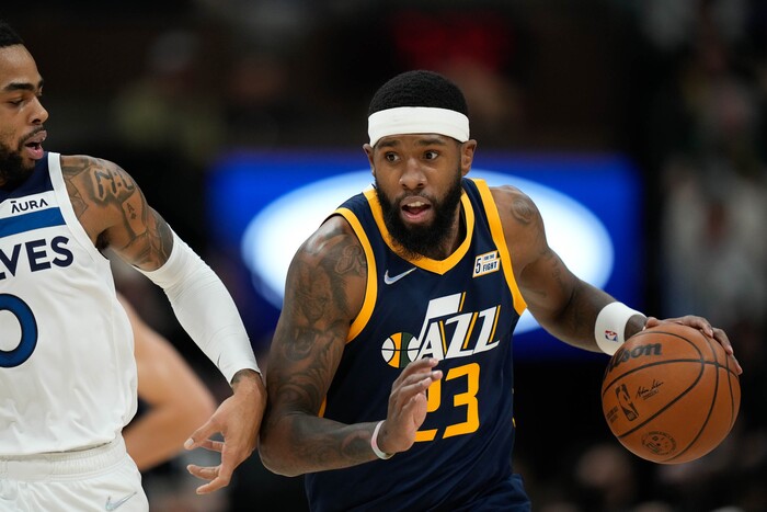 (Francisco Kjolseth | The Salt Lake Tribune) Utah Jazz forward Royce O'Neale (23) maneuvers around Minnesota Timberwolves guard D'Angelo Russell (0) in NBA action between the Utah Jazz and the Minnesota Timberwolves at Vivint Smart Home Arena in Salt Lake City, Thursday, Dec. 23, 2021.