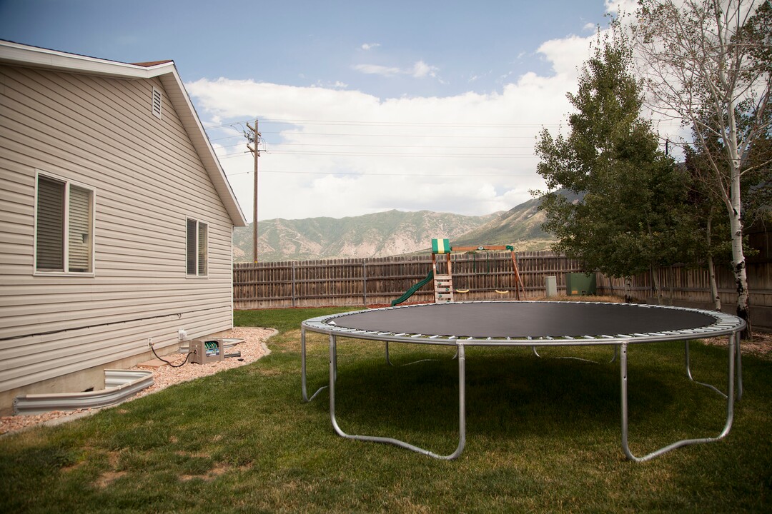 (Stella Yu |  The Salt Lake Tribune) This 2,252-square-foot rambler home in Tooele comes with four bedrooms, three baths, a family room, a kitchen with a bar. The backyard provides room for RV parking, with garden beds on the side yard. 