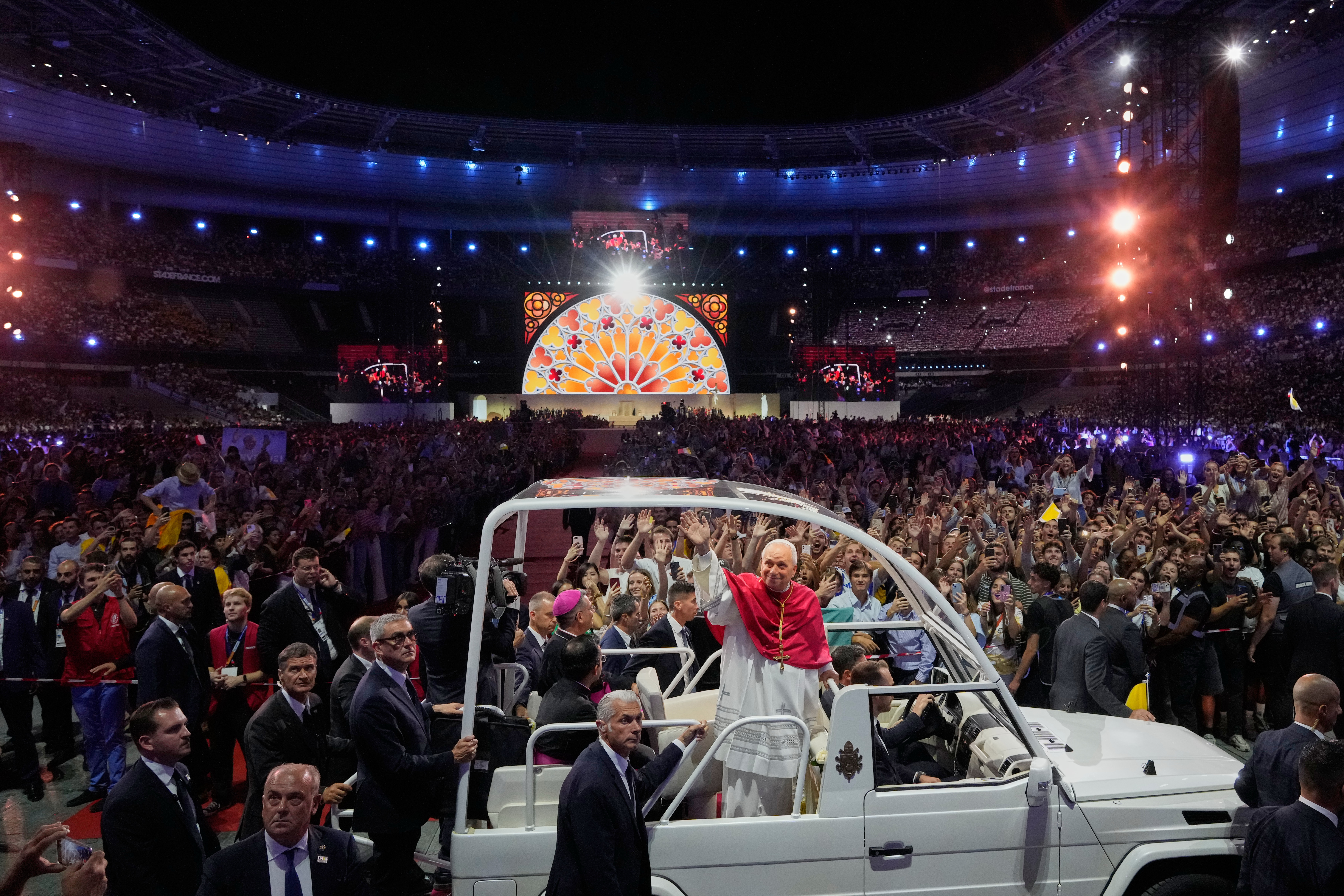 (Gregorio Borgia | AP) Pope Leo XIV arrives on the popemobile at the Stade de France in Saint-Denis near Paris to preside over Vespers with young people, Friday, Sept. 25, 2026, in Saint-Denis.