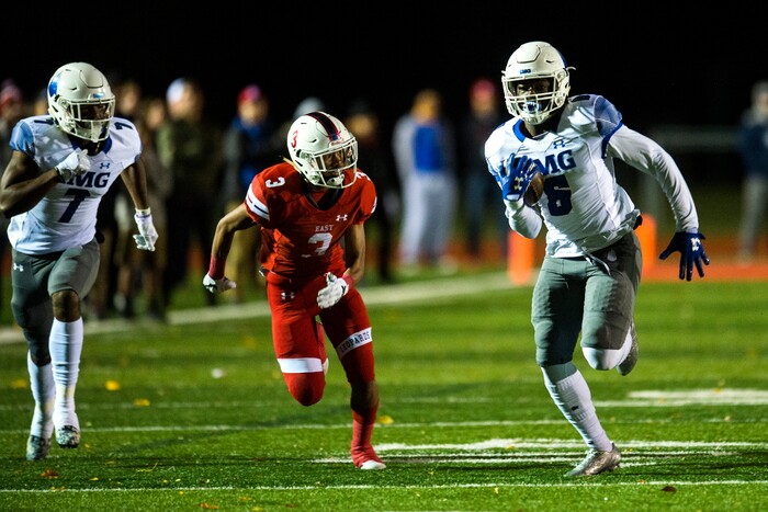 (Chris Detrick  |  The Salt Lake Tribune)  IMG Academy's Trey Sanders (6) runs for a touchdown past East's Mekelee Gautavai (3) during the game at East High School Friday, October 20, 2017. 