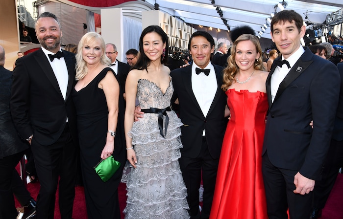 Evan Hayes, from left, Shannon Dill, Elizabeth Chai Vasarhelyi, Jimmy Chin, Sanni McCandless and Alex Honnold, from the cast and crew of "Free Solo," arrive at the Oscars on Sunday, Feb. 24, 2019, at the Dolby Theatre in Los Angeles. (Photo by Charles Sykes/Invision/AP)