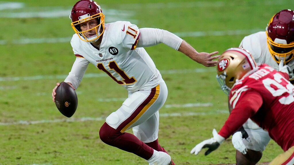 Washington Football Team quarterback Alex Smith (11) scrambles against the San Francisco 49ers during the first half of an NFL football game, Sunday, Dec. 13, 2020, in Glendale, Ariz. (AP Photo/Ross D. Franklin)