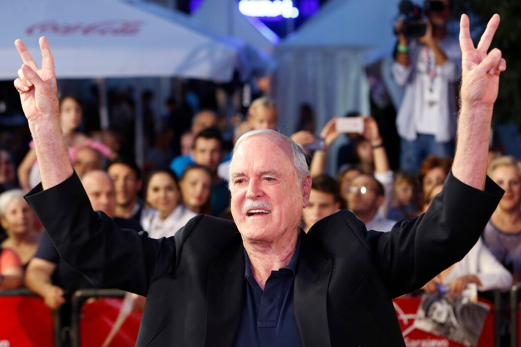 (Amel Emric | The Associated Press)  English actor John Cleese poses for photos as he walks on the red carpet to receive Sarajevo Film Festival's top honour award, the Heart of Sarajevo Award, in Sarajevo, Bosnia, on Wednesday, Aug. 16, 2017.