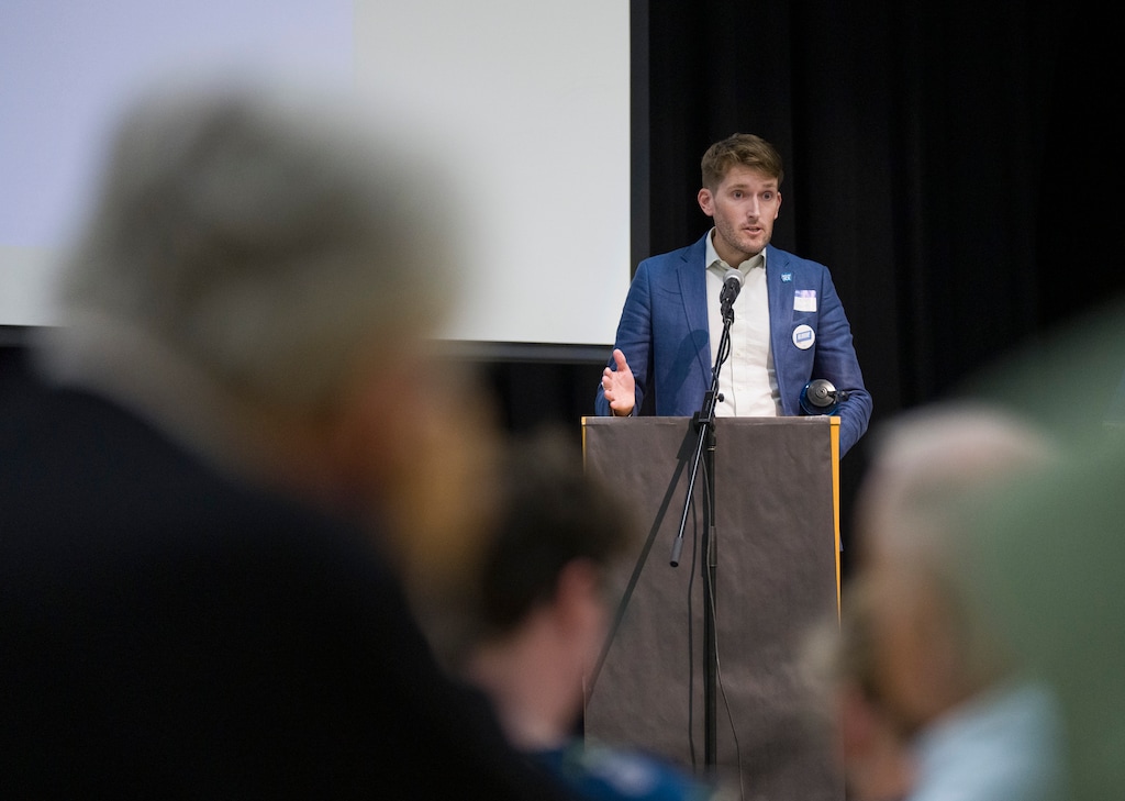 (Bethany Baker  |  The Salt Lake Tribune) Sen. Nate Blouin, D-Millcreek, speaks during caucus night for the Utah Democratic Party at Beacon Heights Elementary in Salt Lake City on Tuesday, March 17, 2026.