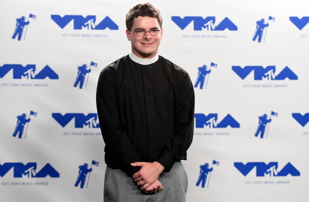 FILE- In this Sunday, Aug. 27, 2017, file photo, Rev. Robert Wright Lee, a descendant of Confederate Army General Robert E. Lee, poses in the press room at the MTV Video Music Awards at The Forum in Inglewood, Calif. Lee is stepping down as pastor of the Bethany United Church of Christ in Winston-Salem, N.C., after negative reactions to his comments supporting racial justice activists on an MTV broadcast. (Photo by Jordan Strauss/Invision/AP, File)