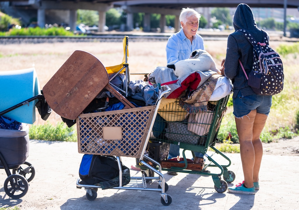 (Rick Egan | The Salt Lake Tribune) Former mayor and current mayoral candidate Rocky Anderson talks to a woman experiencing homelessness near the railroad tracks on 800 East, Thursday, June 8, 2023.