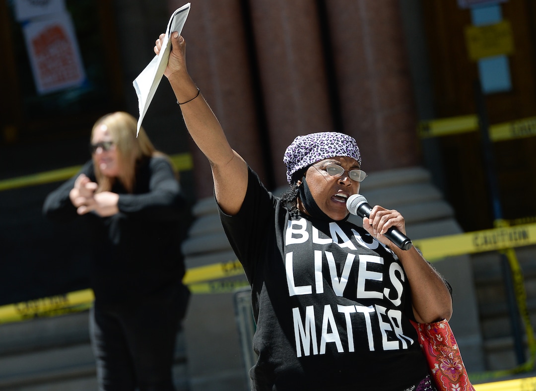(Francisco Kjolseth  |  The Salt Lake Tribune) Cynthia White holds a copy of her great, great grandmother's emancipation papers as she recites a poem entitled "pieces of life,"  as part of Juneteenth celebrations on Friday, June 19, 2020 at City Hall in Salt Lake City.