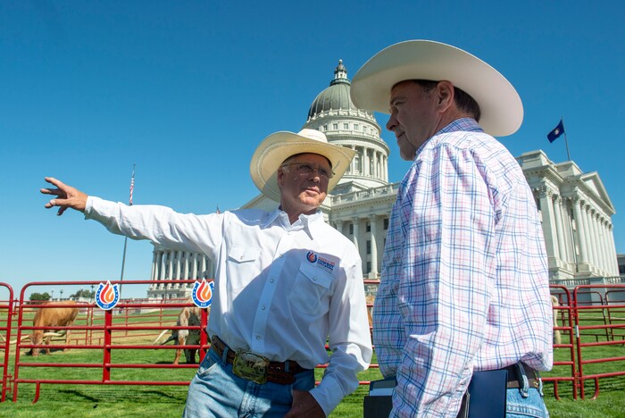 (Rick Egan  |  The Salt Lake Tribune)       Days of 47 Senior Vice President Tom Whitaker talks with Gov. Gary Herbert before a news conference on the lawn of the Utah State Capitol on the Days of 47 festivities, Tuesday, July 16, 2019.