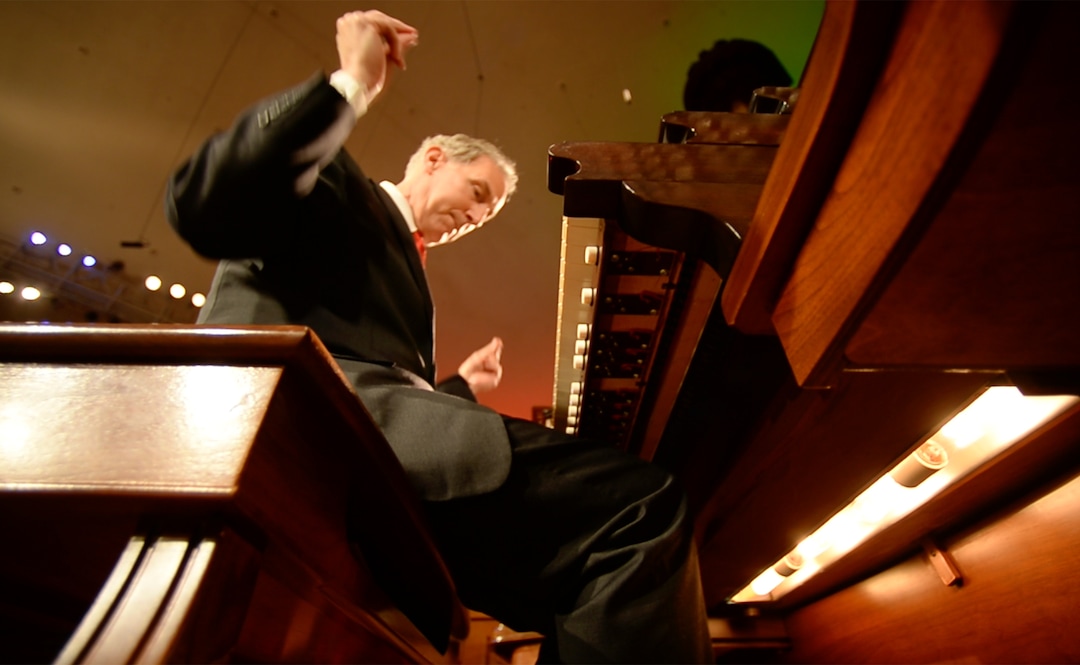 (Rick Egan  |  The Salt Lake Tribune)  Richard Elliott snaps his fingers as he plays "Go Tell if on the Mountain" with his feet.