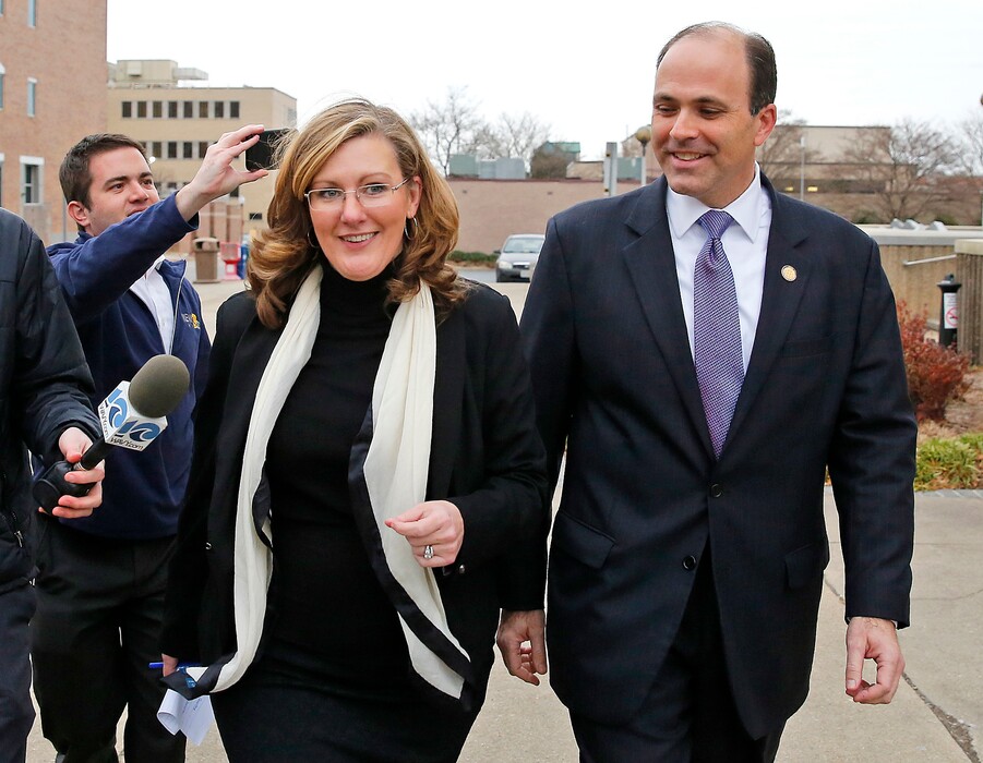 FILE - In this Wednesday, Dec. 20, 2017, file photo, Republican incumbent state Del. David Yancey walks with campaign manager Gretchen Heal outside the Newport News Courthouse in Newport News, Va. A three judge panel on Wednesday, Jan., 3, 2018, has rejected a request to reconsider its ruling in an election recount between Yancey and Democrat challenger Shelly Simonds, that could determine partisan control of the Virginia House of Delegates. State elections officials plan to meet Thursday, Jan. 4, to randomly pick a winner in the contest. (Jonathon Gruenke/The Daily Press via AP, File)