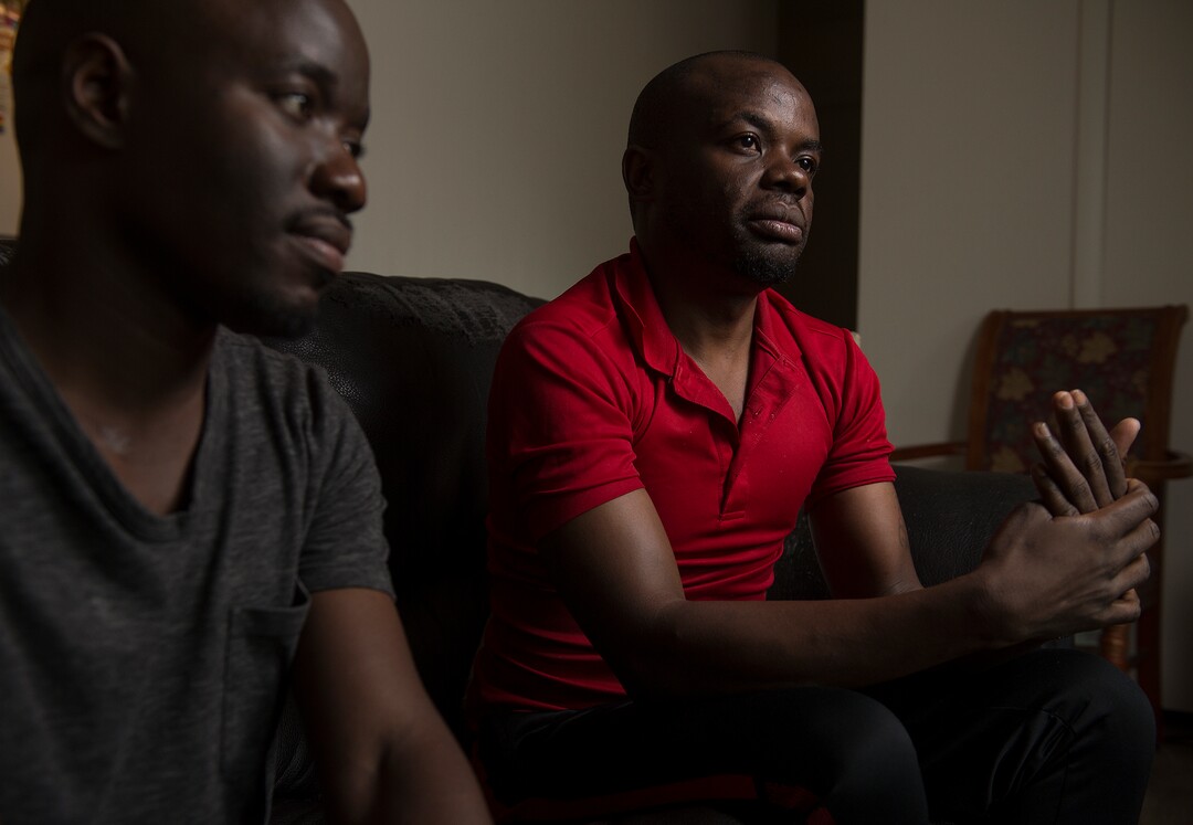 (Leah Hogsten  |  The Salt Lake Tribune) l-r In their native Uganda, a place where being gay can send you to prison, Barnabas Wobiliya and Apollo Kimuli risked their lives as advocates for AIDS education and equality for the LGBTQ community. Threatened with death, both men fled and spent a year in refugee camps before resettlement in Utah. The two are now trying to build their lives here, while using the Internet to continue their activism for others in Africa's LGBTQ community.