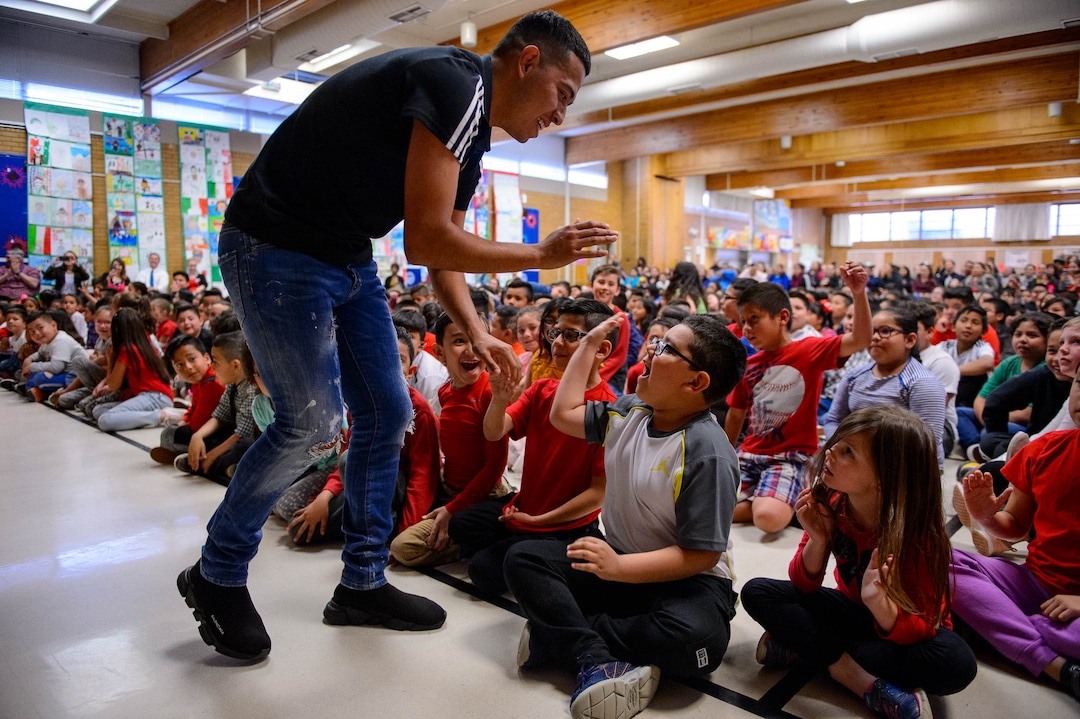 (Trent Nelson  |  The Salt Lake Tribune)  Real Salt Lake player Sebastian Saucedo high-fives Hillsdale Elementary students during an assembly on Tuesday April 30, 2019. The West Valley School celebrated Children's Day, a national observance in Mexico.