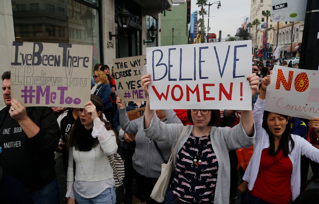 Participants march against sexual assault and harassment at the #MeToo March in the Hollywood section of Los Angeles on Sunday, Nov. 12, 2017.  (AP Photo/Damian Dovarganes)