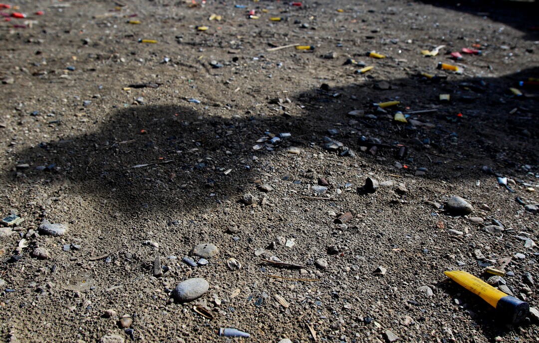 Empty shotgun shells and other debris litter a parking lot near an area used for target shooting in the Lake Mountains area of Utah on Thursday, Feb. 8, 2018. (Evan Cobb/The Daily Herald via AP)