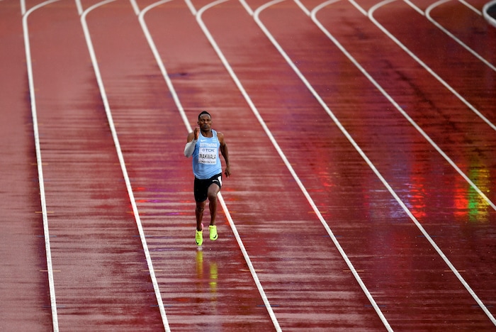 Botswana's Isaac Makwala runs a men's 200-meter individual time trial during the World Athletics Championships in London Wednesday, Aug. 9, 2017. Makwala ran to qualify for the 200m semi-finals after he missed the 200m heats and the 400m final as he was barred from competing for 48 hours while organizers tried to halt a norovirus outbreak. (AP Photo/Martin Meissner)