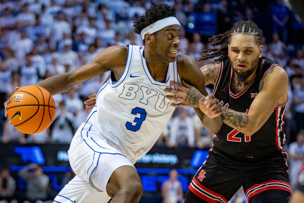 (Rick Egan | The Salt Lake Tribune) BYU Cougars forward AJ Dybantsa (3) drives up the middle as Houston Cougars guard Emanuel Sharp (21) defends Saturday night in Provo.