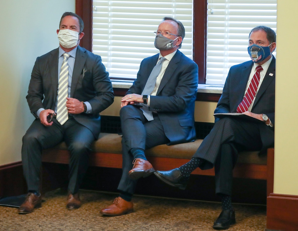 (Steve Griffin | Deseret News, pool) House Speaker Brad Wilson, R-Kaysville, Senate President Stuart Adams, R-Layton, and Gov. Gary Herbert listen as Derek Miller, president and CEO, Salt Lake Chamber and Downtown Alliance, speaks during the daily COVID-19 briefing at the Capitol in Salt Lake City on Wednesday, June 17, 2020. 