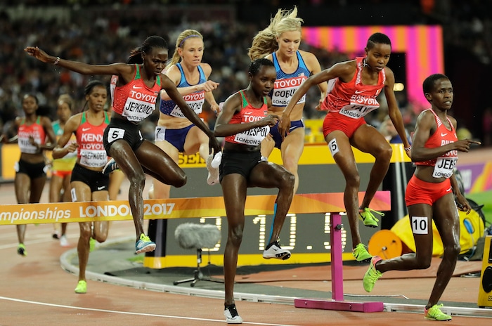 Runners leap a jump in their Women's 3000 meters steeplechase final during the World Athletics Championships in London Friday, Aug. 11, 2017. (AP Photo/Tim Ireland)