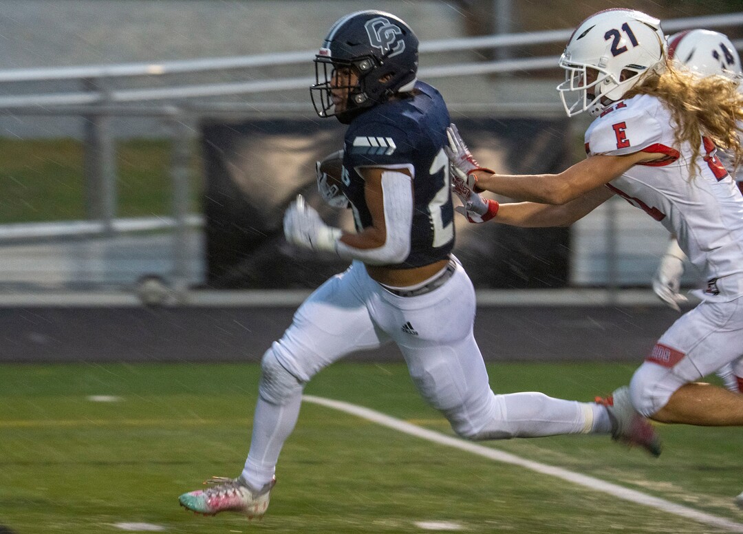 (Rick Egan | The Salt Lake Tribune) Tre Kofe (20) out runs East High's Tayvn Weaver, for a touchdown for the Chargers, in prep football action between Corner Canyon Chargers and the East Leopards, on Saturday, Aug. 21, 2021.
