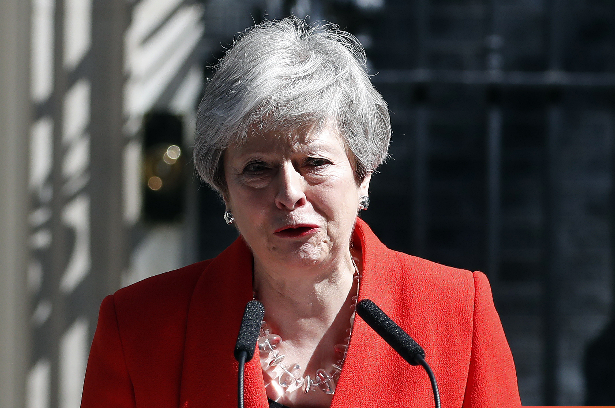 (Alastair Grant | AP) British Prime Minister Theresa May reacts as she makes a speech in the street outside 10 Downing Street in London, England, Friday, May 24, 2019. Theresa May says she'll quit as UK Conservative leader on June 7, sparking contest for Britain's next prime minister.