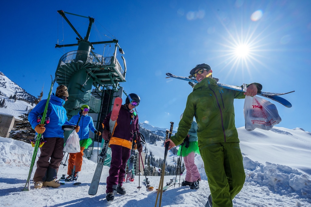 (Trent Nelson  |  The Salt Lake Tribune) A group from Ski Utah at Snowbird's Chickadee, on their way to becoming the first to ski/snowboard all 15 Utah resorts in one day, on Friday, March 17, 2023. USA Today is asking skiers and snowboarders to pick their favorite resorts in North America for 2024-25. Snowbird made the 20-nominee cut for resort and ski school.