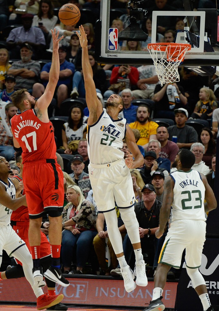 (Francisco Kjolseth  |  The Salt Lake Tribune) Toronto Raptors center Jonas Valanciunas (17) shoots past Utah Jazz center Rudy Gobert (27) in the first half of the preseason NBA game at Vivint Smart Home Arena Tuesday, Oct. 2, 2018, in Salt Lake City.