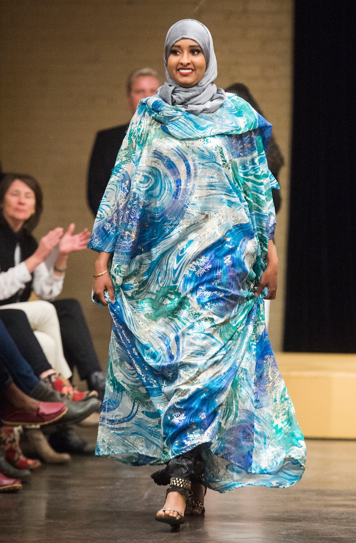 (Rick Egan  |  The Salt Lake Tribune) Halima Noor, models an outfit from Somalia at the 8th Annual Women of the World Fashion Show. The fashion show fund is raiser for the non-profit that seeks to help refugees settle in a new culture. Wednesday, March 7, 2018.