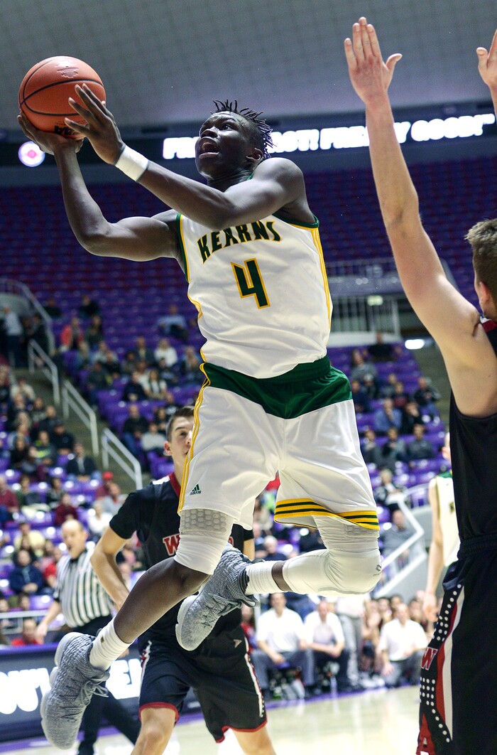 (Leah Hogsten  |  The Salt Lake Tribune) Kearns' Emmanuel Andrew (04) with the dunk. Andrew had 10 points and 17 rebounds. Weber defeated Kearns 60-52 in the 6A High School Boys' Basketball Tournament opening game at Weber State University’s Dee Events Center in Ogden, Tuesday, Feb. 27, 2018. 