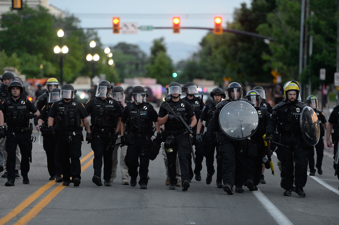 (Francisco Kjolseth  |  The Salt Lake Tribune) Police line up to enforce a mandatory curfew in Salt Lake City on Monday, June 1, 2020, following violence and unrest over the weekend due to the death of George Floyd by police.