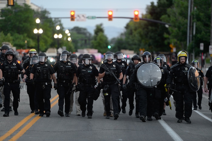 (Francisco Kjolseth  |  The Salt Lake Tribune) Police line up to enforce a mandatory curfew in Salt Lake City on Monday, June 1, 2020, following violence and unrest over the weekend due to the death of George Floyd by police.