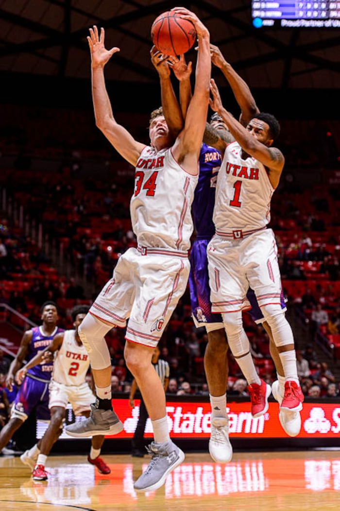 (Trent Nelson | The Salt Lake Tribune)  Utah Utes forward Jayce Johnson (34), Northwestern State Demons forward Ishmael Lane (20) and Utah Utes guard Justin Bibbins (1) collide as the University of Utah hosts Northwestern State, NCAA basketball in Salt Lake City, Wednesday December 20, 2017.