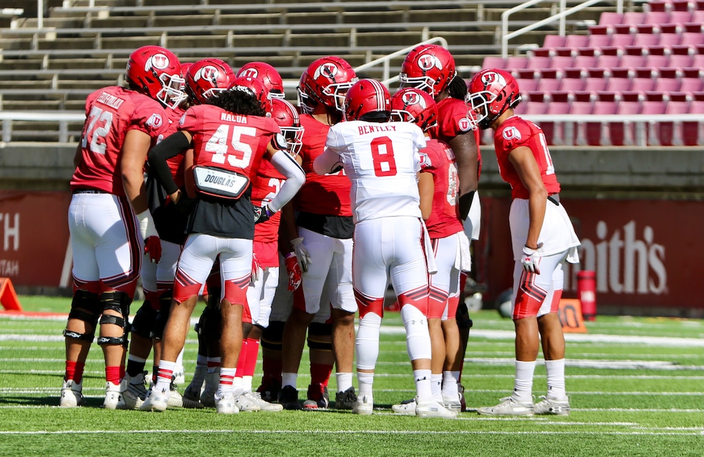 (Photo courtesy of Utah Athletics) Quarterback Jake Bentley huddles up the Utes offense during a practice session