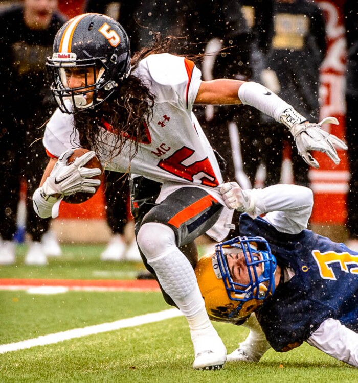 (Trent Nelson | The Salt Lake Tribune)  Mountain Crest's Lepi Taukiuvea (5) and Orem's Ben Daley (3) as Orem faces Mountain Crest in the Class 4A High School State Football Championship game in Salt Lake City, Friday November 17, 2017.